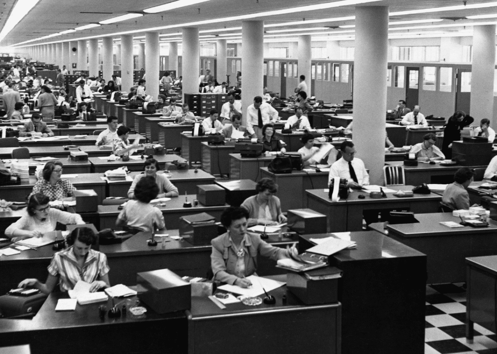 History of LGBTQ+ inclusion in the American workforce image 4 -- old black and white photo of vast office filled with women at desks