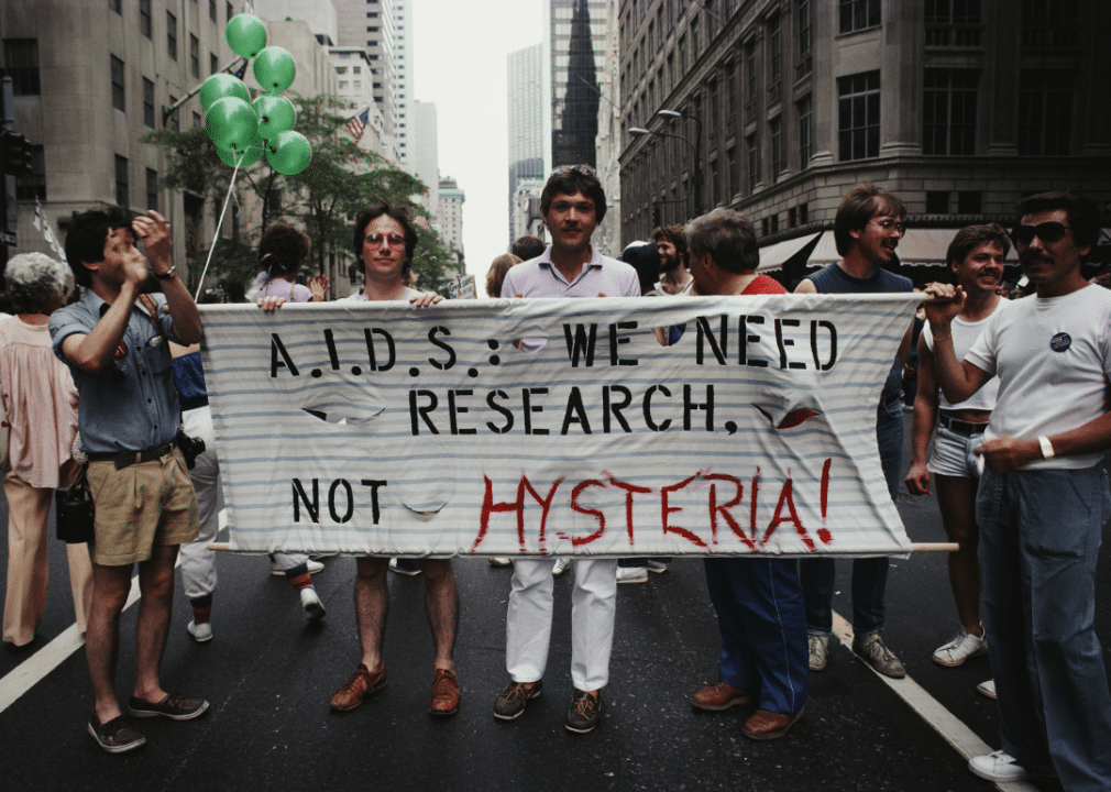 History of LGBTQ+ inclusion in the American workforce image 5 -- marchers at a protest for AIDS research