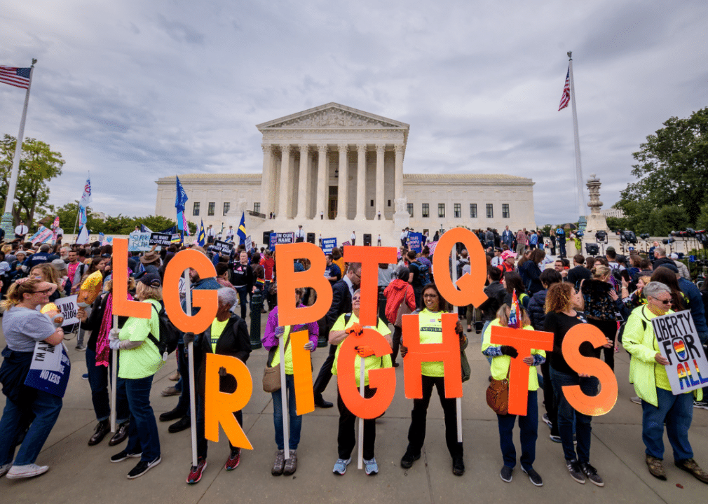 History of LGBTQ+ inclusion in the American workforce image 10 -- activists holding up letters spelling LGBTQ RIGHTS in front of the Lincoln Memorial